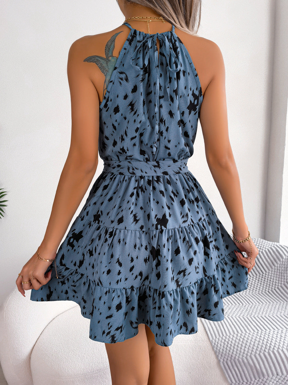 Stylish summer fashion beach dress displayed in khaki print